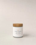 Body butter jar with cork-toned lid and white label, Natalic Organics