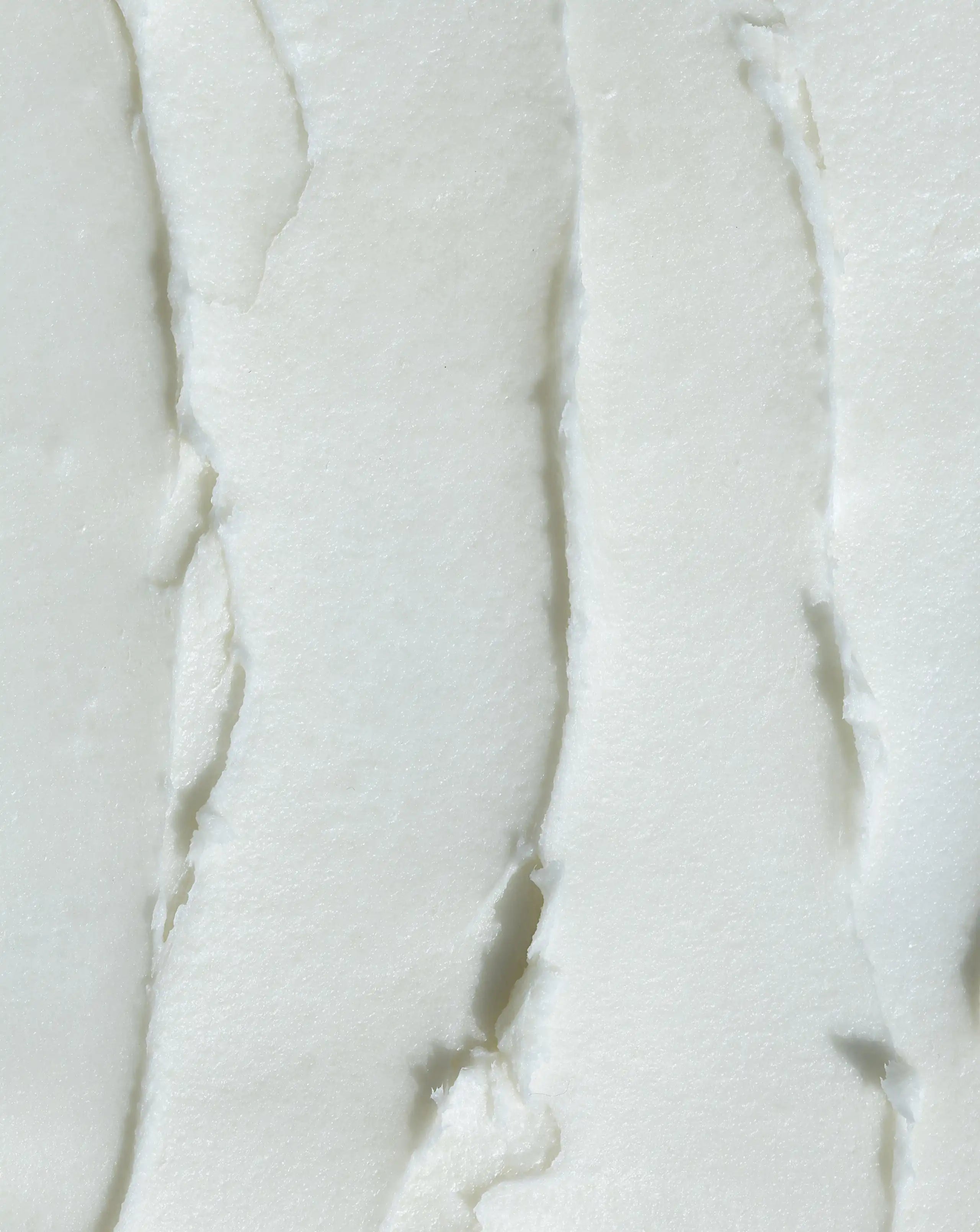 Thick white body butter with smooth swirl texture