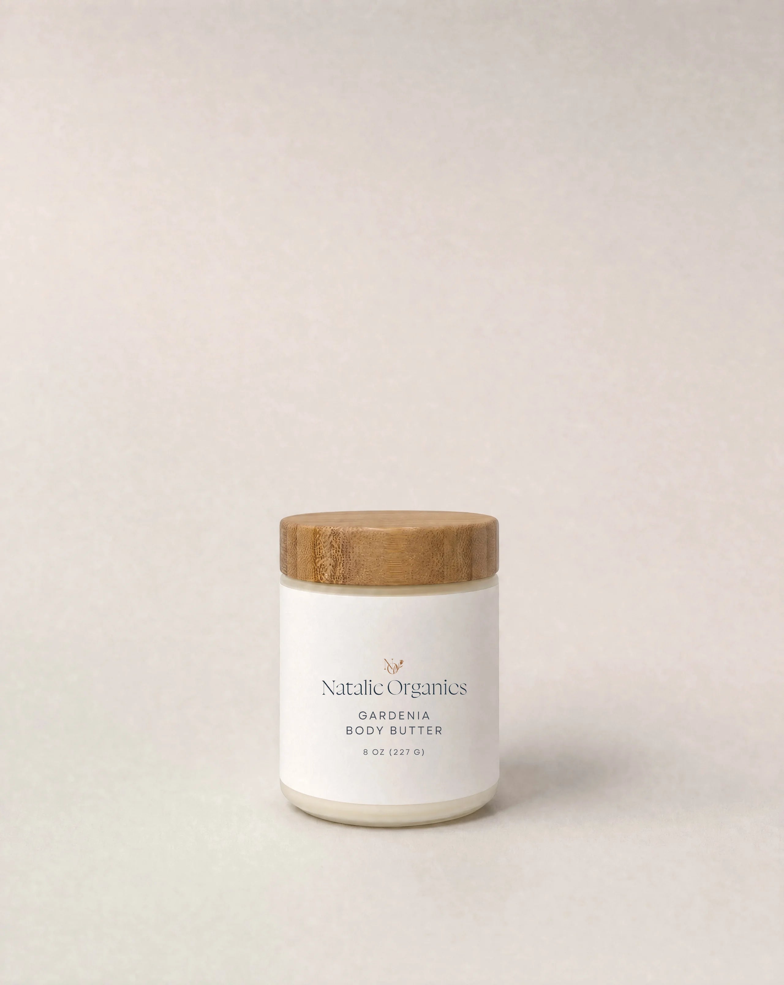 Gardenia body butter jar with white label and cork lid