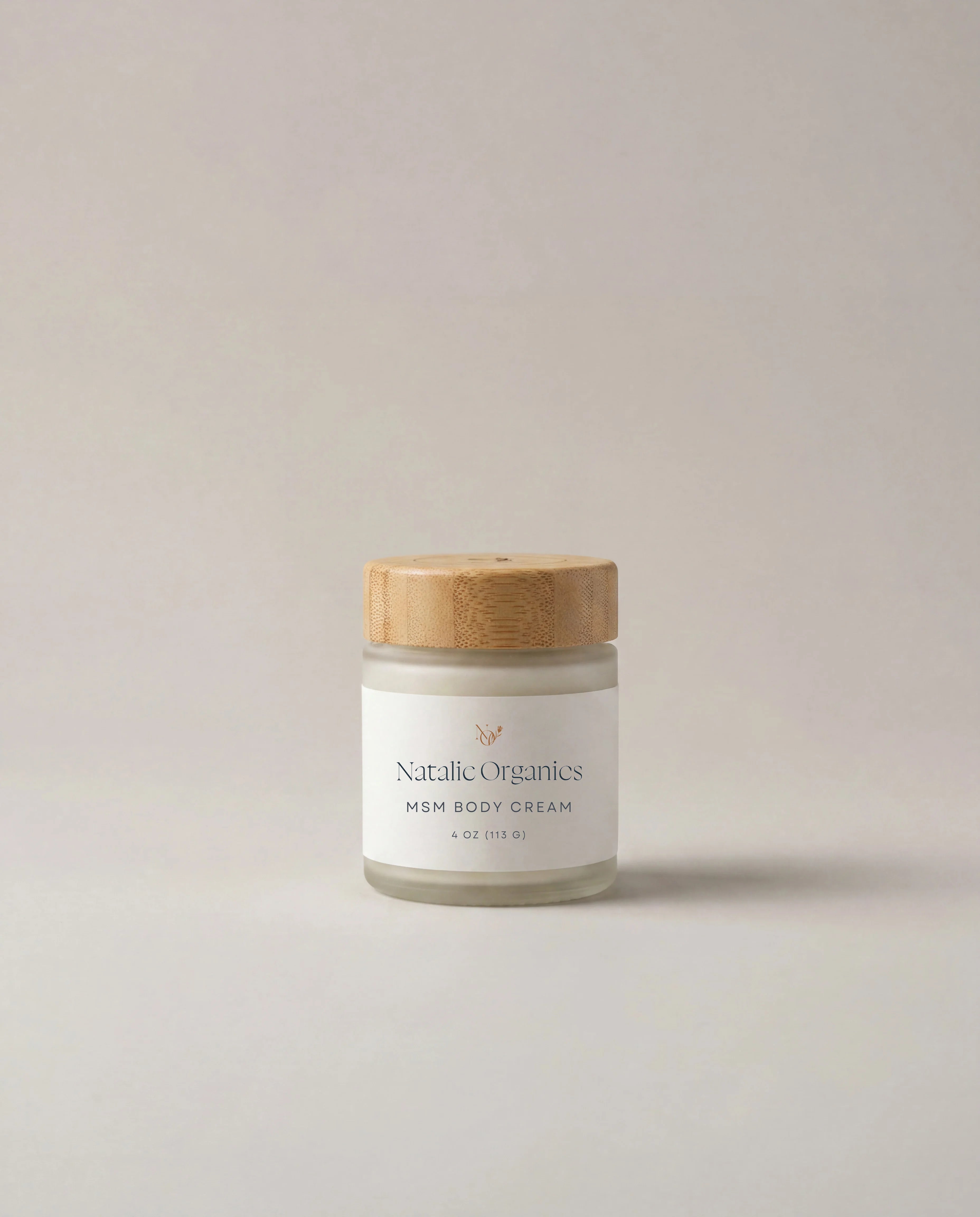 MSM body cream jar with wooden lid and white label, light cream container