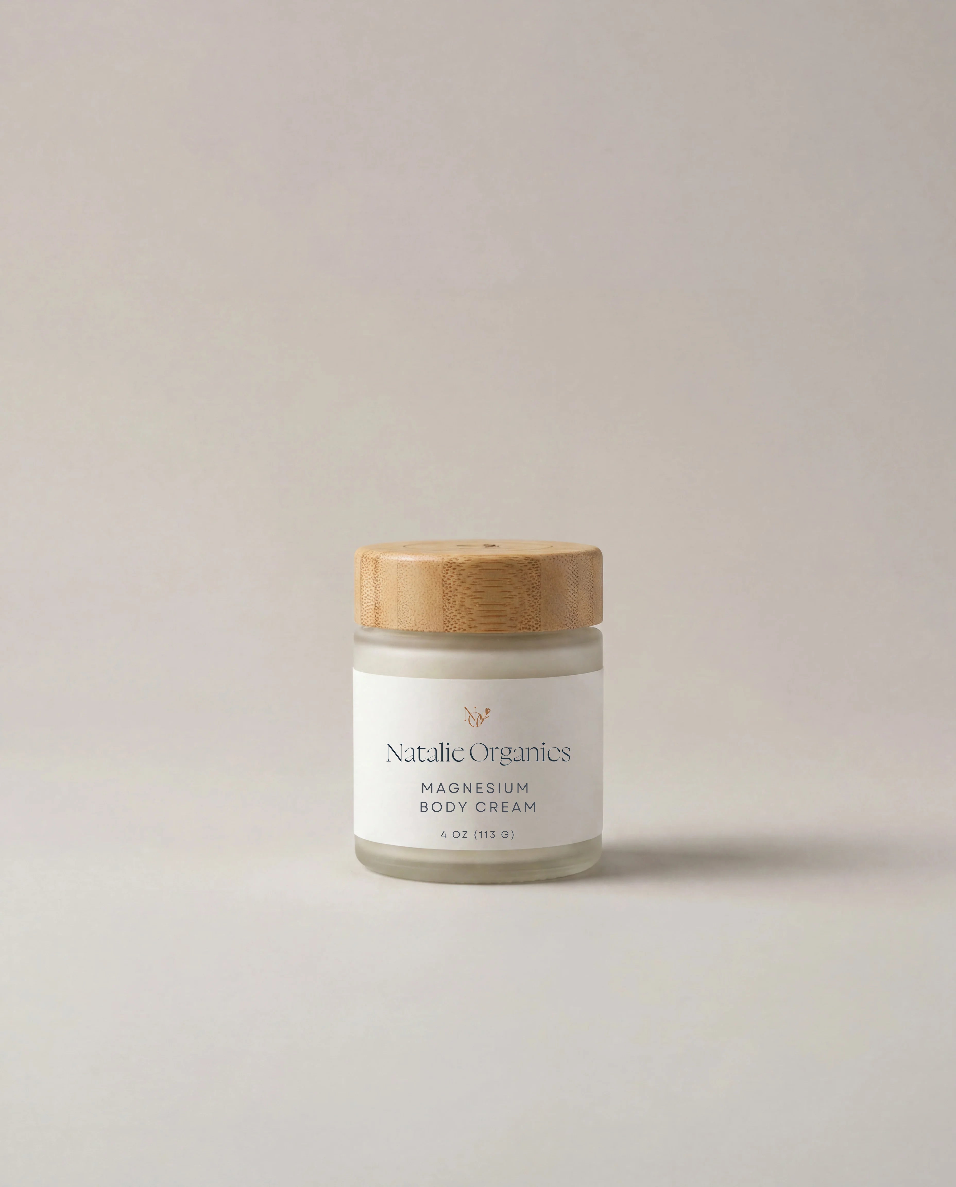 Magnesium body cream jar with wooden lid and white label