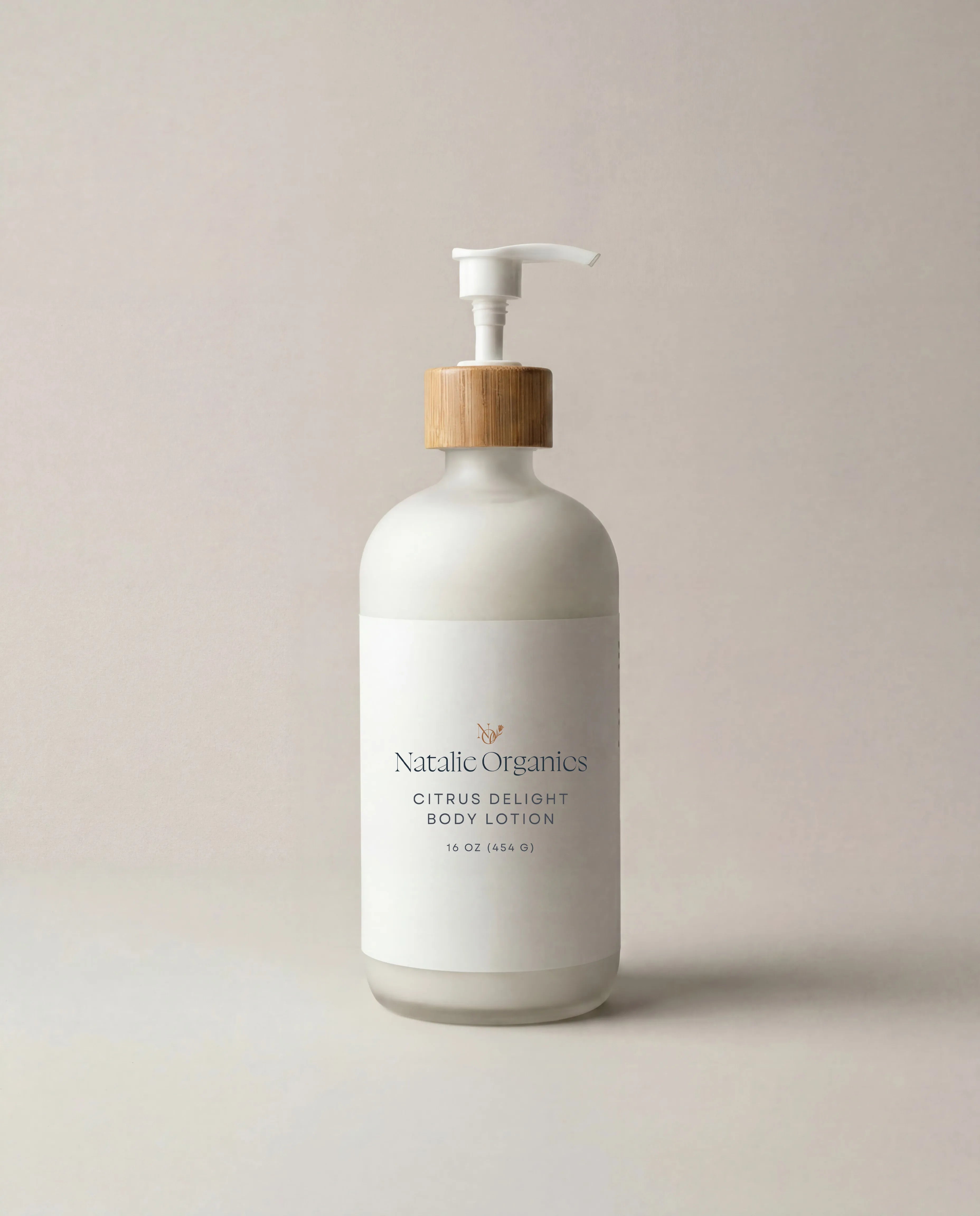 Body lotion bottle with white pump dispenser, white label on a rounded bottle