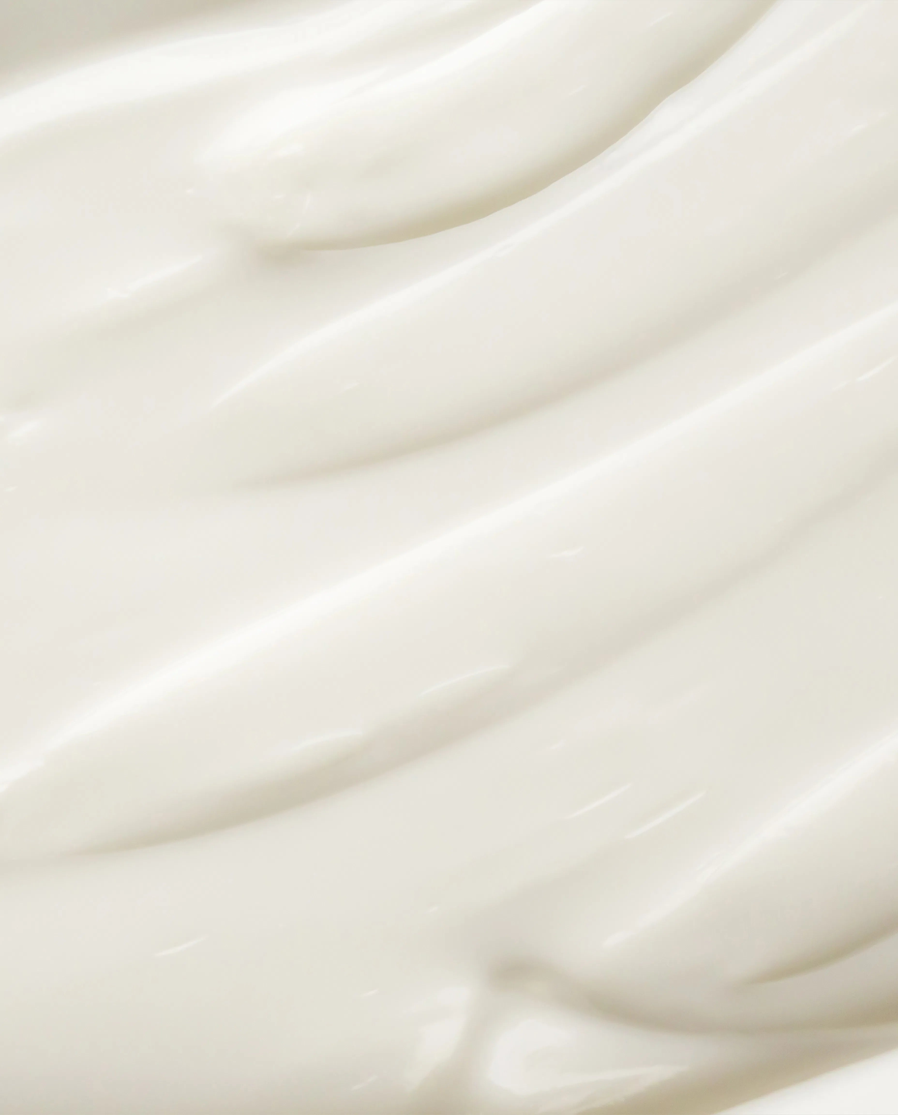 Magnesium body cream close-up, thick white cream texture