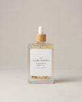 Chamomile body oil bottle with wooden dropper cap