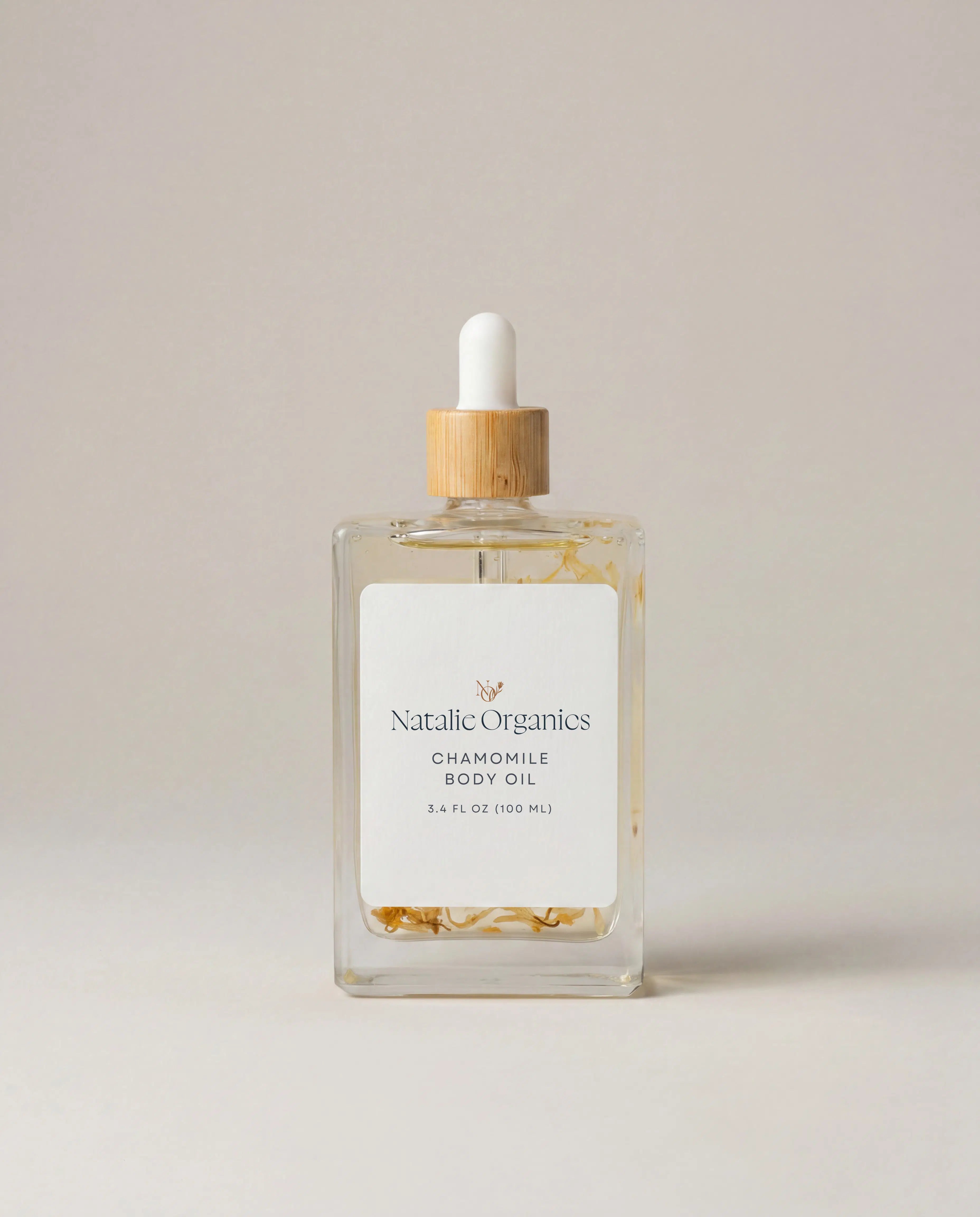 Chamomile body oil bottle with wooden dropper cap