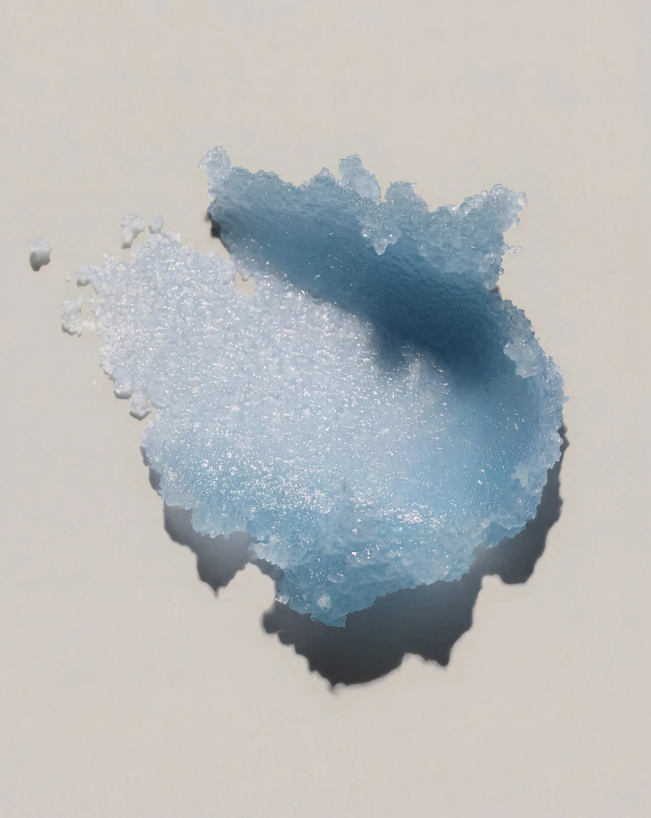 Blue body scrub paste with grainy exfoliating texture