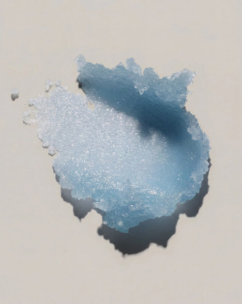 Blue body scrub paste with grainy exfoliating texture