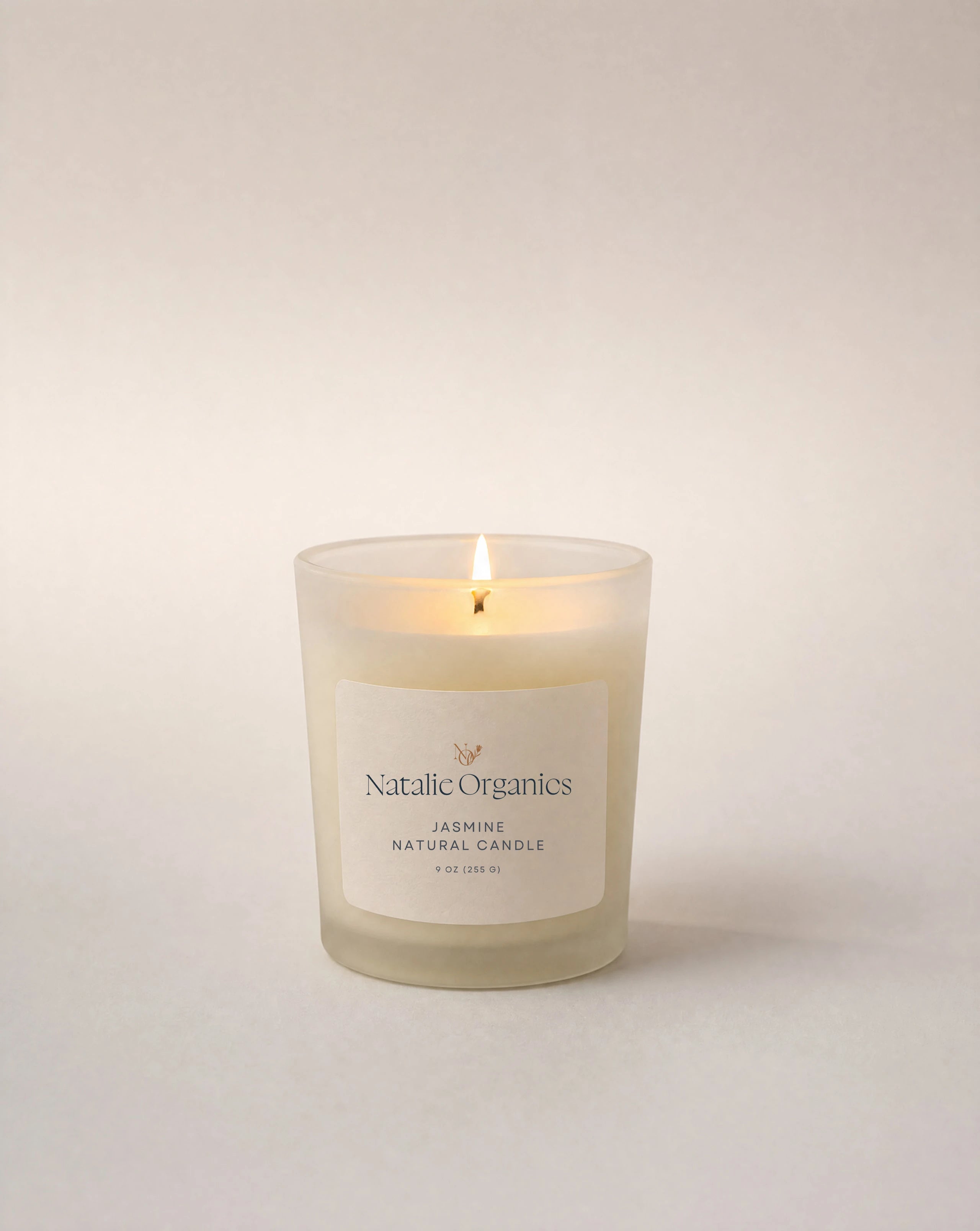 Jasmine candle in clear glass, cream wax, Natalie Organics label
