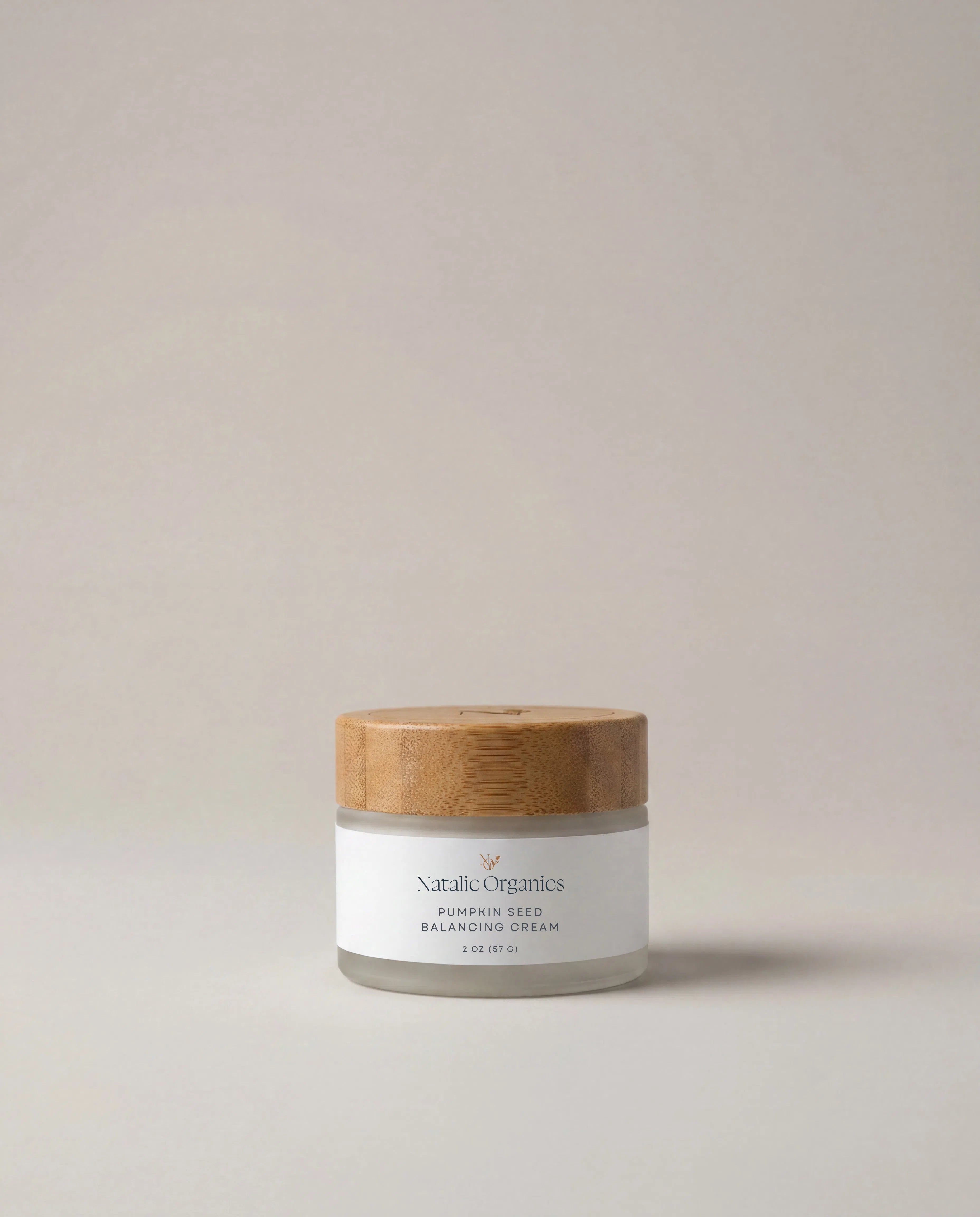 Pumpkin seed balancing cream jar with wooden lid and white label