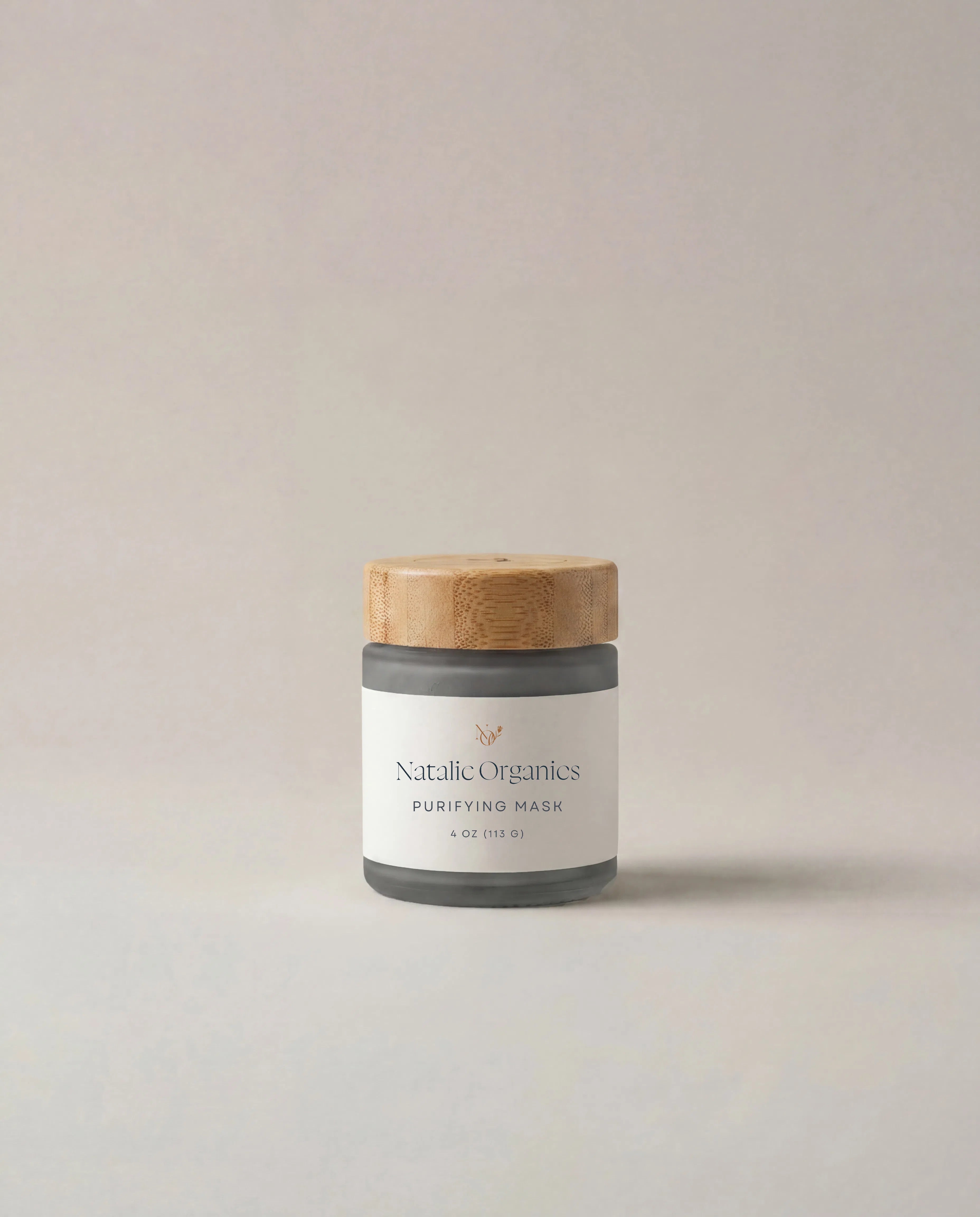 Purifying mask jar with wood cap, labeled Natalic Organics