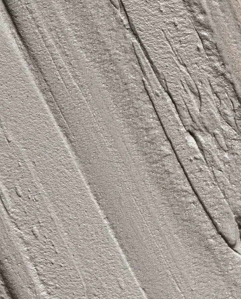 Gray textured surface with raised lines and creases, close-up