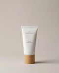 Rose hand cream tube with white squeeze bottle and bamboo cap