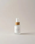 Hyaluronic hydration serum bottle with pump and wooden dispenser cap