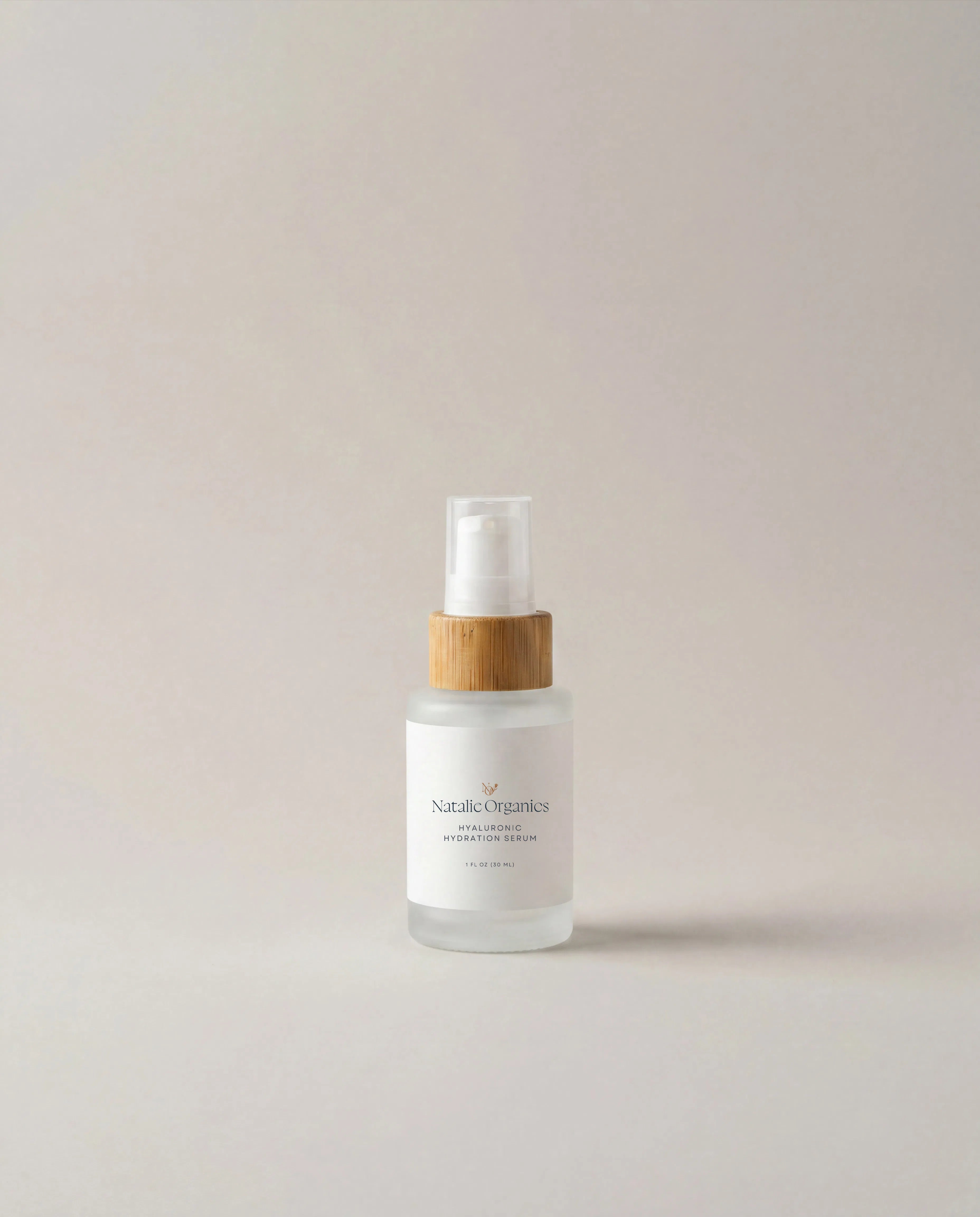 Hyaluronic hydration serum bottle with pump and wooden dispenser cap