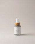 Radiance day serum bottle with clear pump and gray frosted label