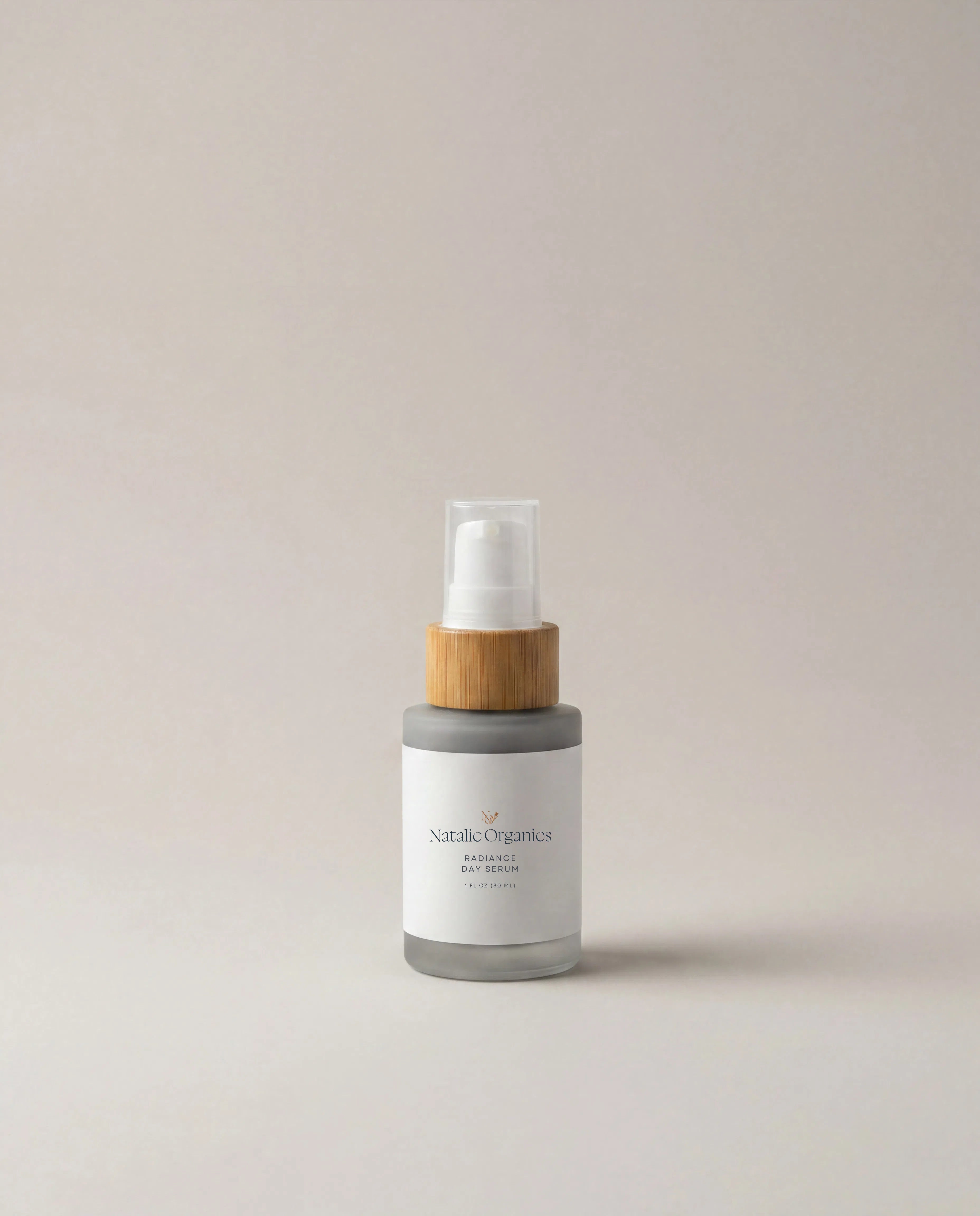 Radiance day serum bottle with clear pump and gray frosted label